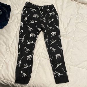 Boys. H&M. Size 6-8. Black with white dinosaur skeletons.